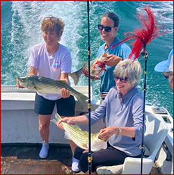 A happy trio of succesful anglers on board the Sunmai II